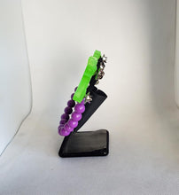 Load image into Gallery viewer, Ray Gun Cardigan Clips in Glow in the Dark Neon Green and Purple