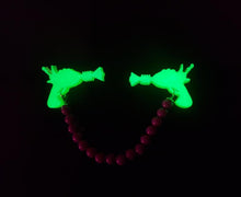 Load image into Gallery viewer, Ray Gun Cardigan Clips in Glow in the Dark Neon Green and Purple