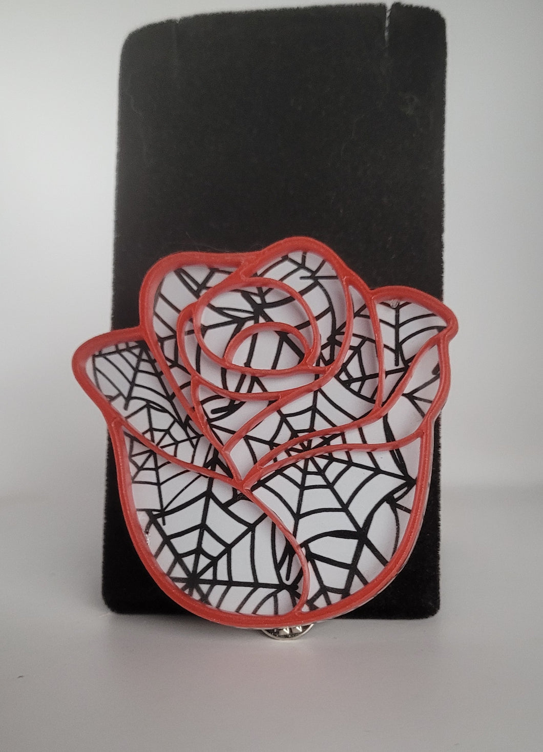 Rose Brooch in Spiderweb and Red Acrylic