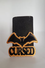 Load image into Gallery viewer, Cursed Brooch in Black Gloss and Orange Glitter Acrylic

