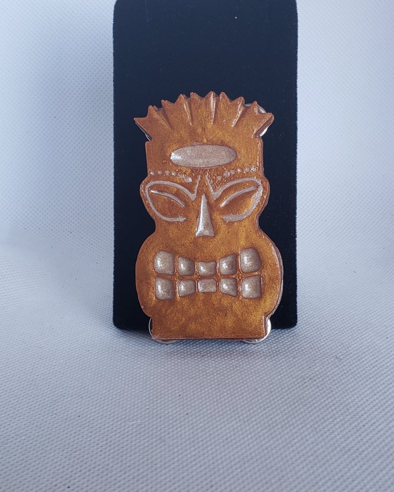 Tiki Brooch in bronze, beige, and brown