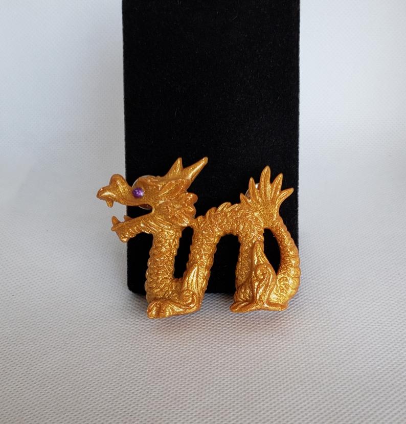 Dragon Brooch in gold and purple resin